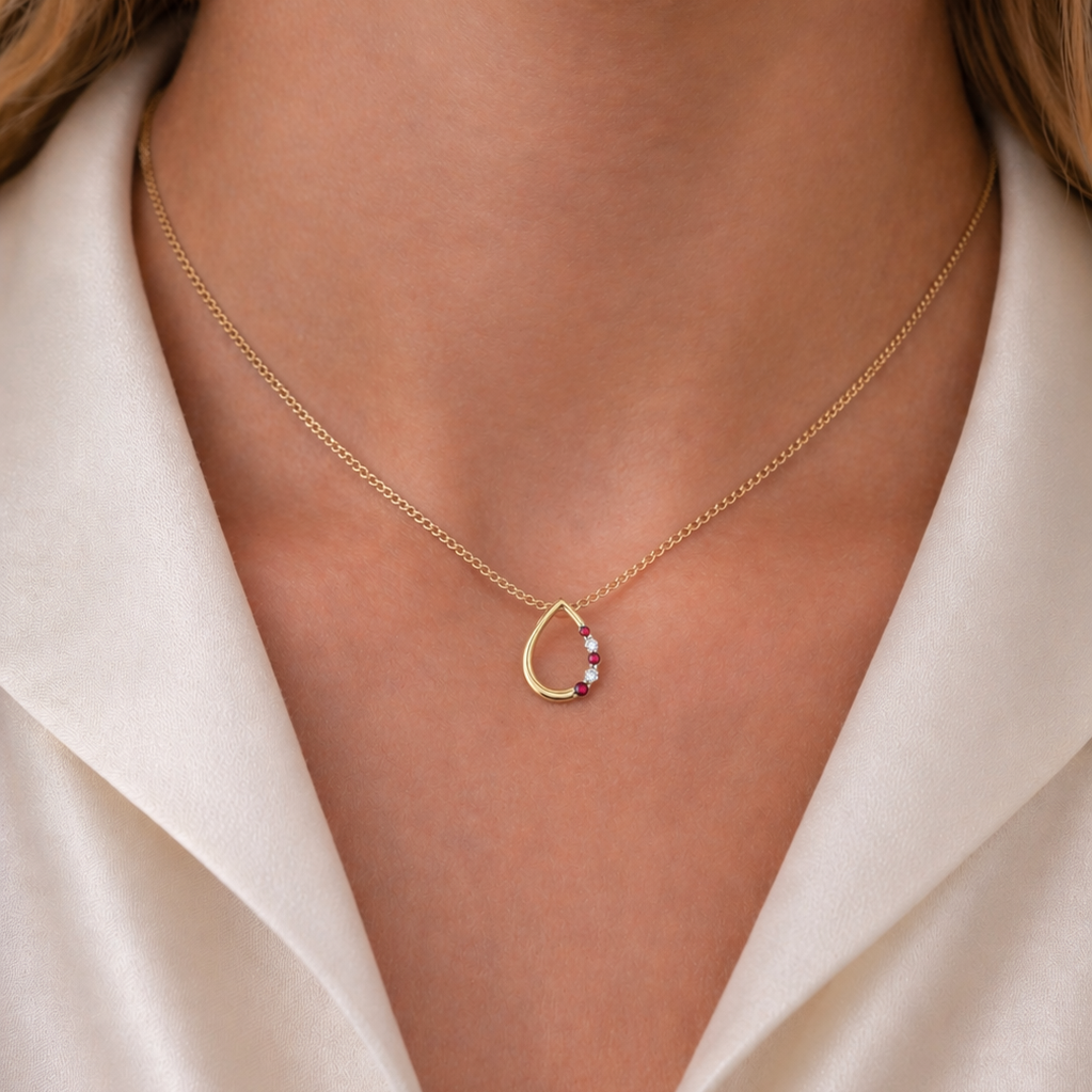 9ct yellow gold ruby & diamond pear shaped pendant