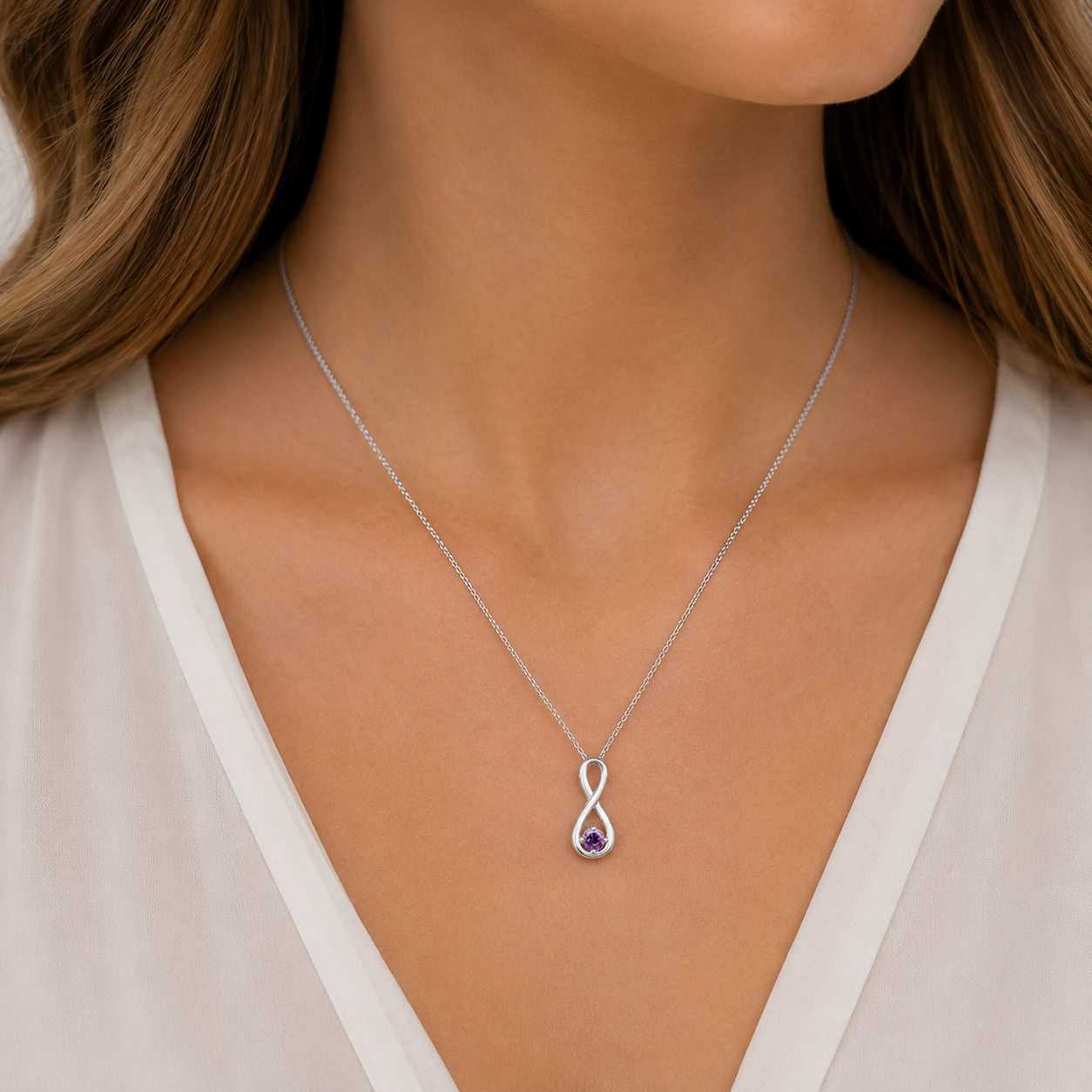 Sterling Silver purple cubic zirconia infinity pendant