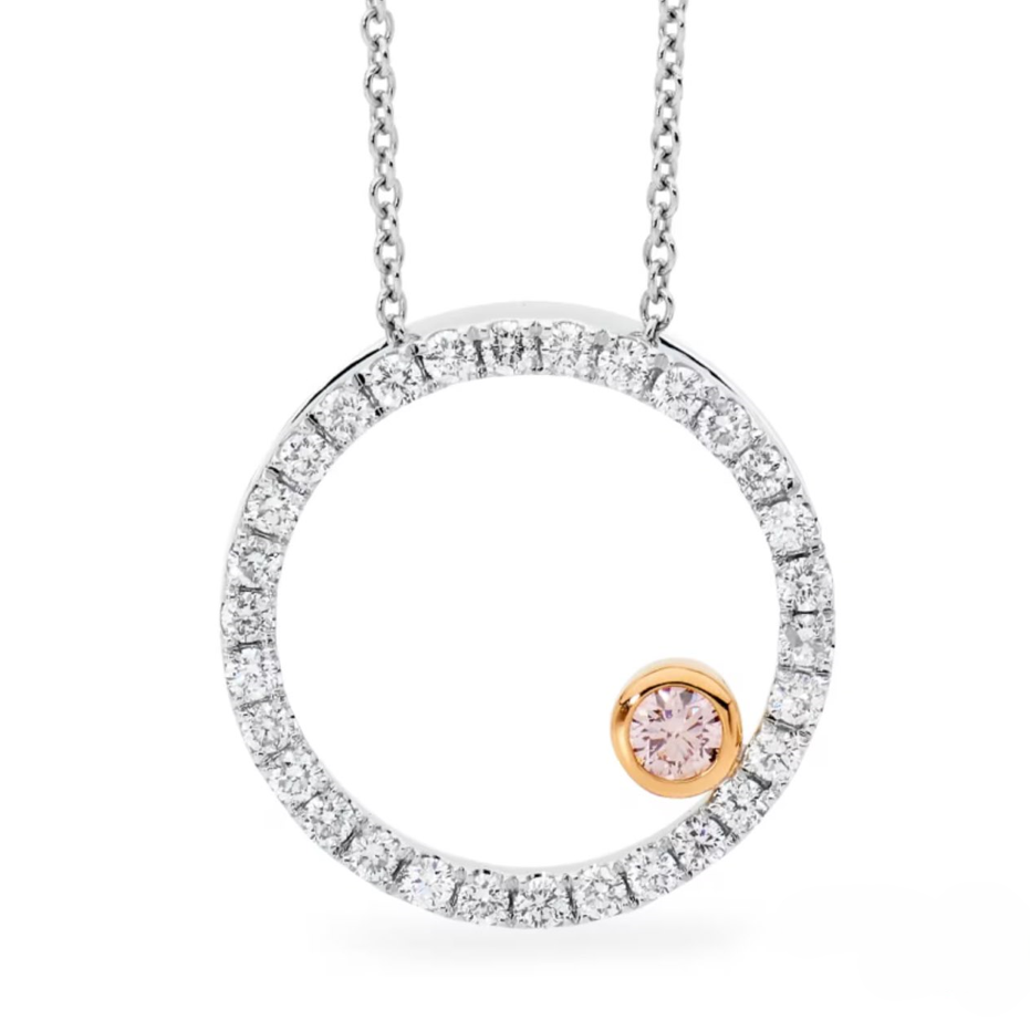 Pendant with a circular diamond claw set design featuring an offset australian pink diamond set in rose gold on a white background