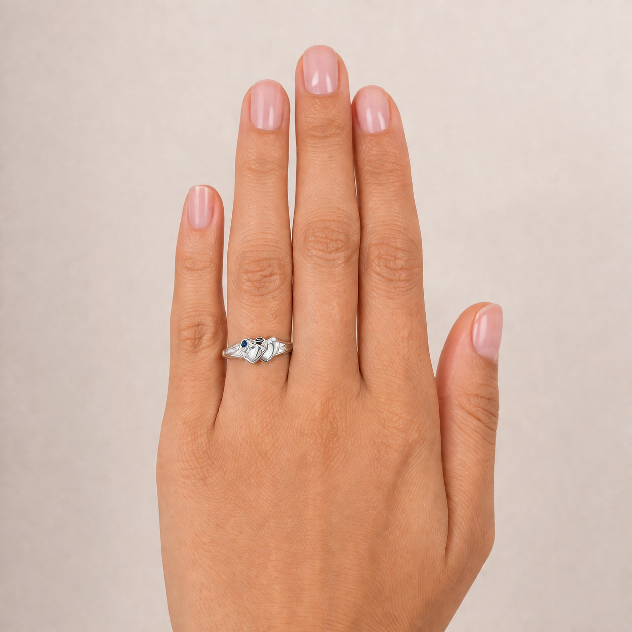 Sterling Silver Signet ring with a double heart design and a blue stone feature