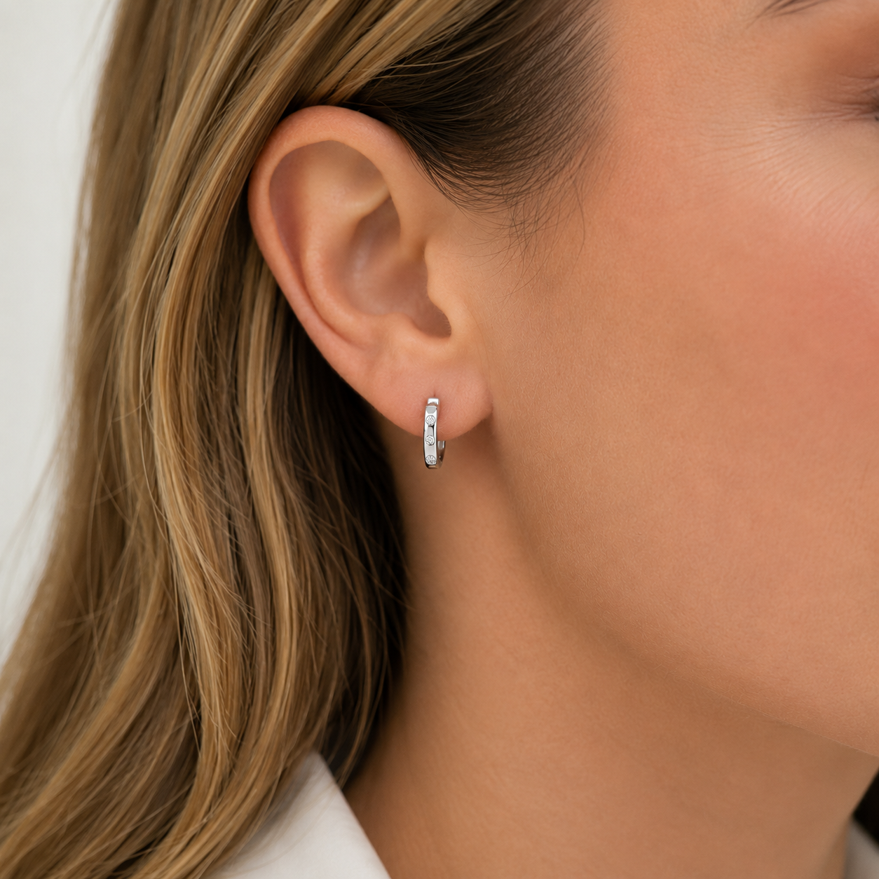 Sterling Silver cubic zirconia set huggie earrings